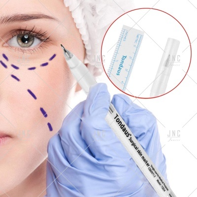 Marcador cirúrgico com texto Tondaus e rosto com linhas pontilhadas roxas