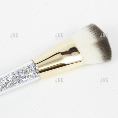 Pincel de maquilhagem com cabo de glitter e cerdas brancas e pretas