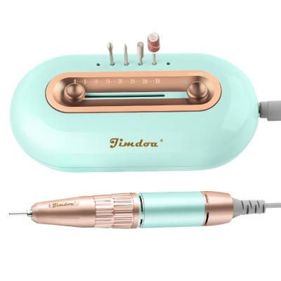 máquina elétrica de manicure azul água com detalhes dourado rosa e pontas metálicas.