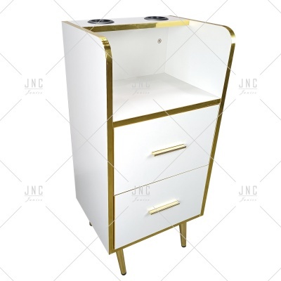 Móvel branco com detalhes dourados e duas gavetas