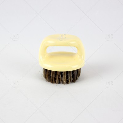 Escova redonda amarela com cerdas escuras
