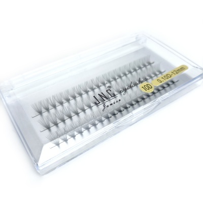 Estojo transparente de pestanas falsas com etiqueta amarela