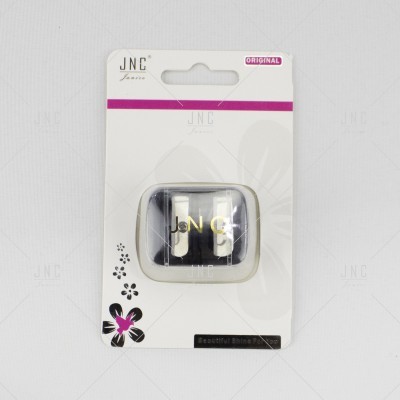 acessório de cabelo preto e dourado embalada em cartão branco com detalhes em rosa