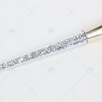 Pincel de maquilhagem com cabo transparente e pedras brilhantes prateadas