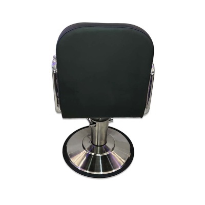 Cadeira de cabeleireiro preta vista de costas com base metálica circular.