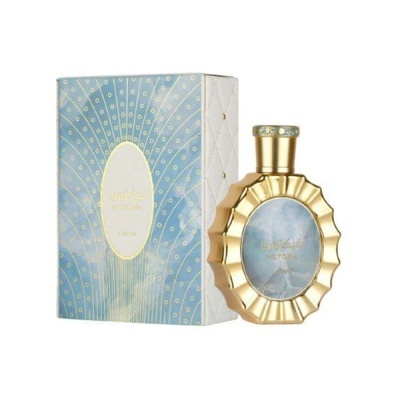 perfume dourado com caixa azul clara decorada