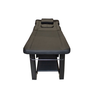 Cama de massagem preta com almofada e abertura para rosto