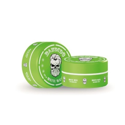 Embalagem verde redonda de pomada para cabelo BADBOY matte wax com ilustração de cabeça masculina.
