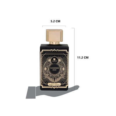 Frasco de perfume preto com tampa dourada e texto Goodness Oud
