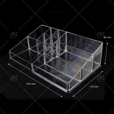 Organizador acrílico transparente com divisões e medidas em fundo preto