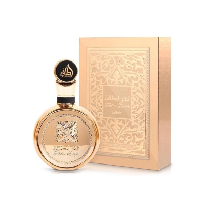 Frasco dourado de perfume com embalagem dourada e detalhes florais