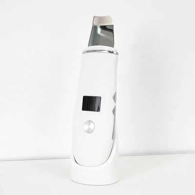 Dispositivo eletrônico branco com ecrã e botões prateados em base branca