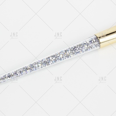 Pincel de maquilhagem com cristais prateados no cabo e metal dourado