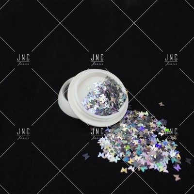 Pote branco com glitter holográfico em forma de borboletas sobre fundo preto