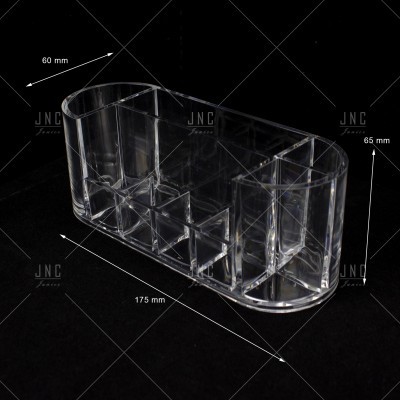 Organizador acrílico transparente com compartimentos variados sobre fundo preto