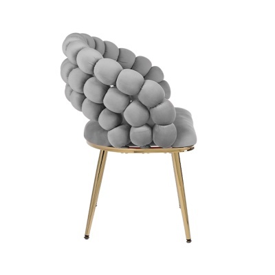 Cadeira cinzenta acolchoada com pernas metálicas douradas