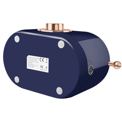 aparelho de maquilhagem azul escuro com detalhes dourados e manípulo lateral