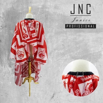 Capa de corte de cabelo vermelha e branca com padrão Barber Shop num manequim