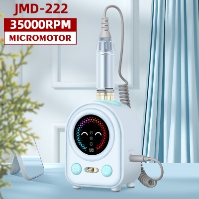 Micromotor JMD-222 branco com painel digital colorido e indicação 35000RPM num ambiente interior com cortinas azuis