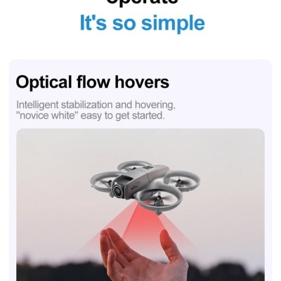Drone cinzento com quatro hélices voando acima de uma mão e luz vermelha projetada para baixo