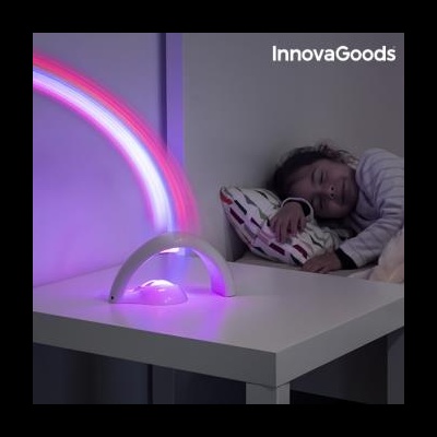 Abajur LED arco branco a iluminar mesa branca ao lado de criança deitada na cama