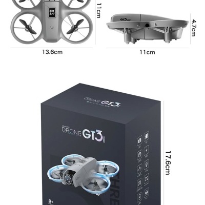 Drone cinza GT3 com quatro hélices e embalagem preta