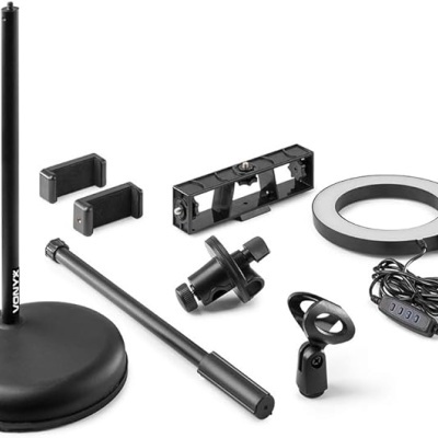 Conjunto de acessórios de microfone preto com base redonda, anel de luz LED e suportes.