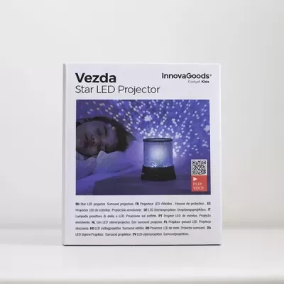 Caixa branca do projetor LED de estrelas Vezda da InnovaGoods com imagem do produto e estrelas azuis projetadas