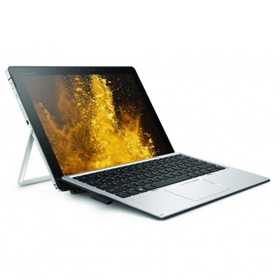 Computador portátil prateado com teclado preto e ecrã amarelo