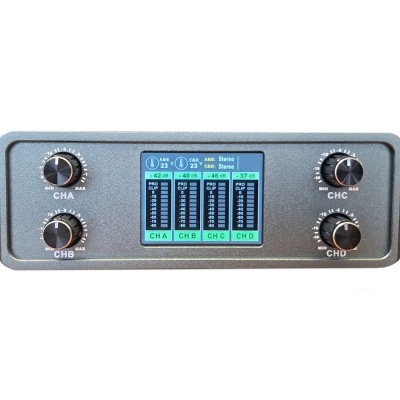 Painel de equipamento eletrónico com botões e ecrã digital colorido a mostrar níveis de som e temperaturas.