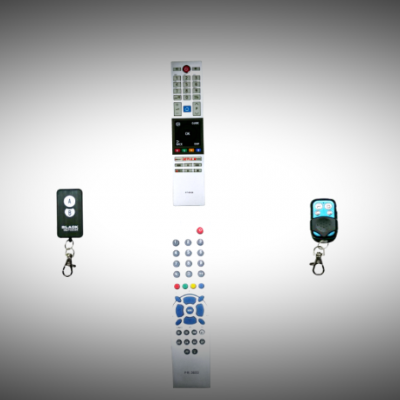 Vários comandos remotos de diferentes tamanhos e cores sobre fundo cinza