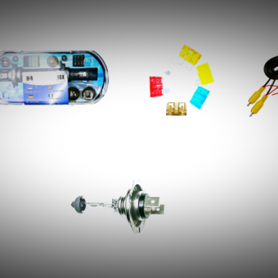 Componentes eletrónicos e ferramentas de teste sobre fundo branco.