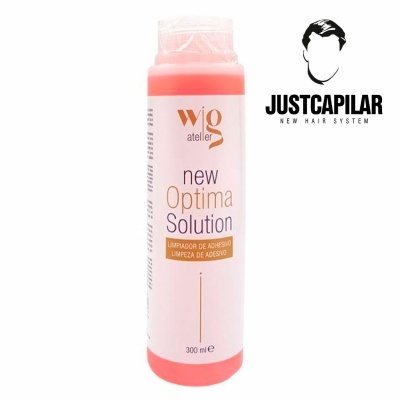 Frasco plástico rosa com etiqueta branca de solução de limpeza de adesivo