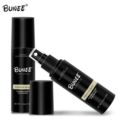 Frascos pretos de spray para cabelo Bunee Luxury Hair Care Fiberhold Spray com texto visível, fundo branco.