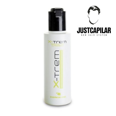 Frasco de produto capilar X-TREM com tampa preta e logotipo JUSTCAPILAR