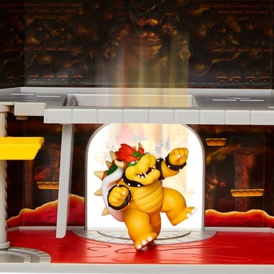 Figura de ação de Bowser num cenário de gruta com chão vermelho