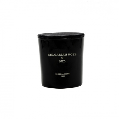 Vela perfumada preta com texto dourado e tampa preta