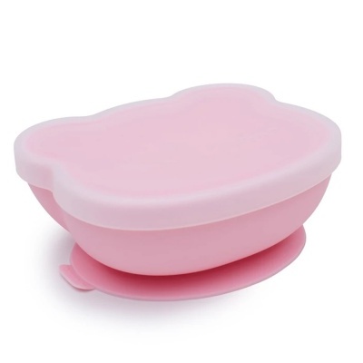 Recipiente de plástico rosa com tampa e ventosa na base