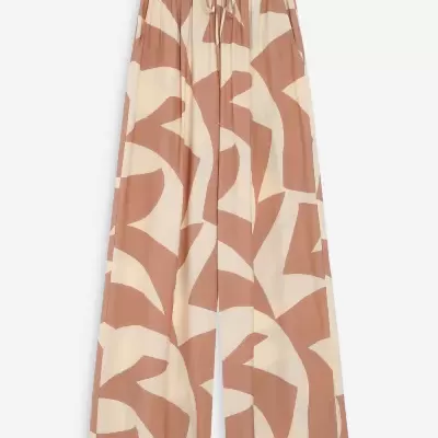 Calças largas com padrão abstracto em tons de bege e castanho claro.