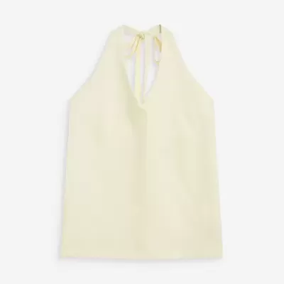 Top creme com alças para amarrar e decote em V.