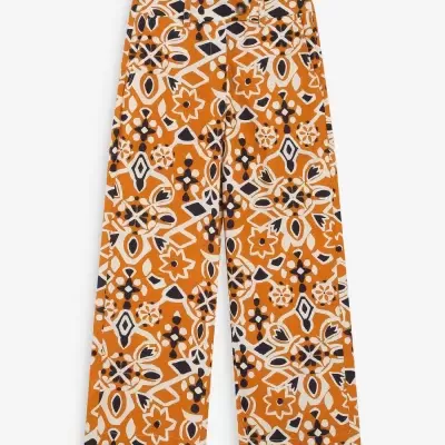 Calças com padrão geométrico laranja, preto e branco