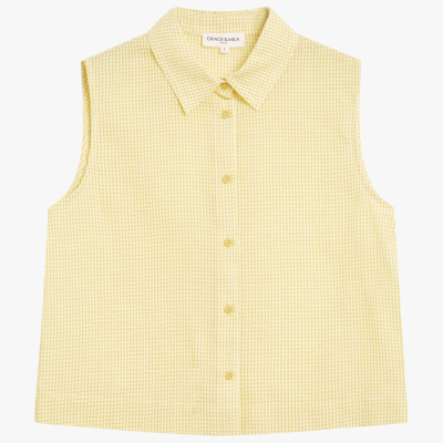 Camisa sem mangas amarelo claro com padrão quadriculado vichy e botões