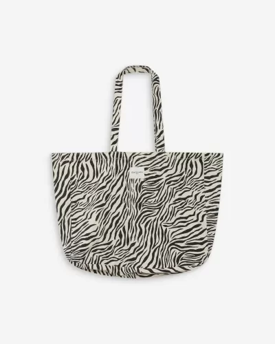 Bolsa zebrada em preto e branco com alças compridas e etiqueta GRACE & MILA