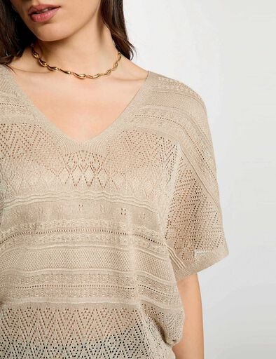 Camisola de malha bege com padrão geométrico e decote em V