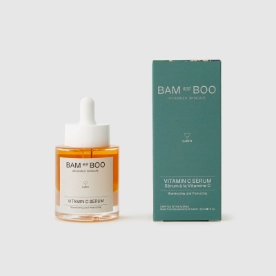 Frasco de sérum com conta-gotas e embalagem verde com texto BAM and BOO