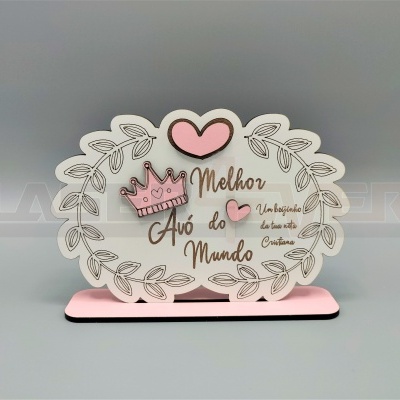 Placa decorativa oval com base rosa e texto em castanho e rosa