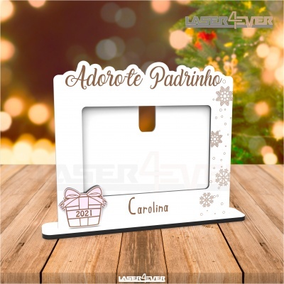 Moldura fotográfica branca decorada com texto e desenhos de presente e flocos de neve