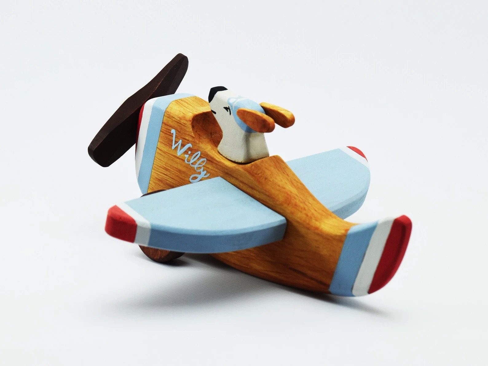 Figura decorativa de avião de madeira com cão no cockpit