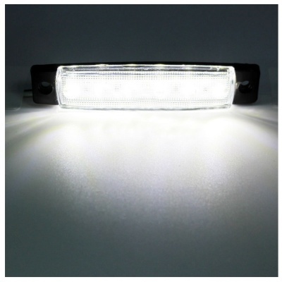 Luz rectangular LED branca com moldura preta sobre superfície branca