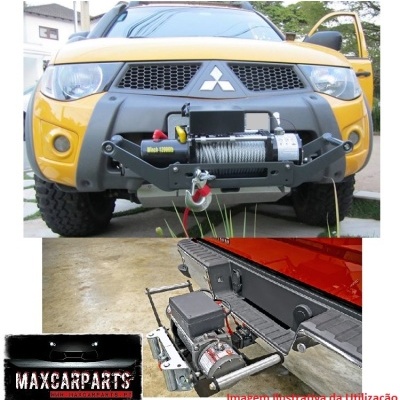 Carro Mitsubishi amarelo com guincho elétrico preto instalado no para-choques